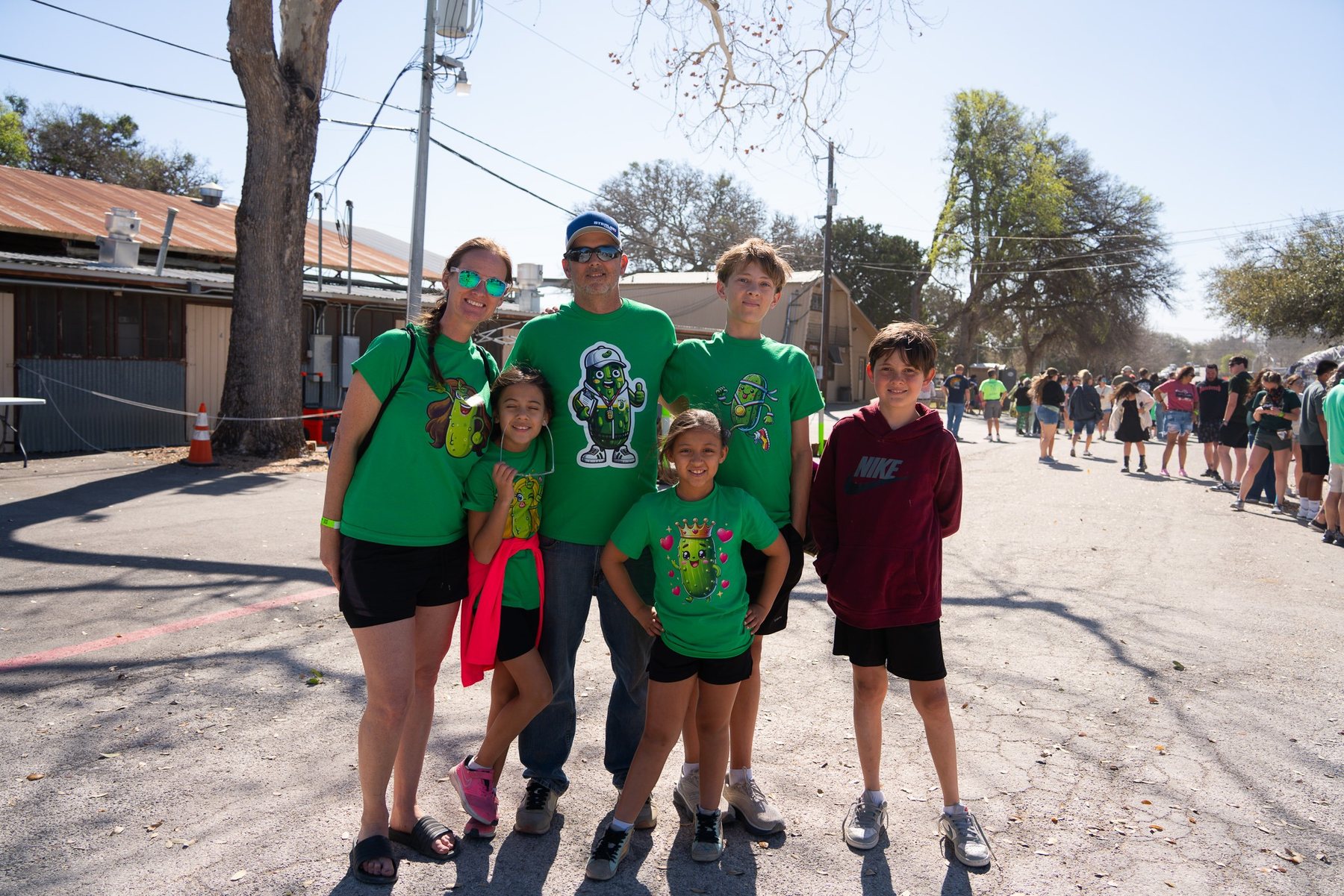 Family wearing pickle shirts